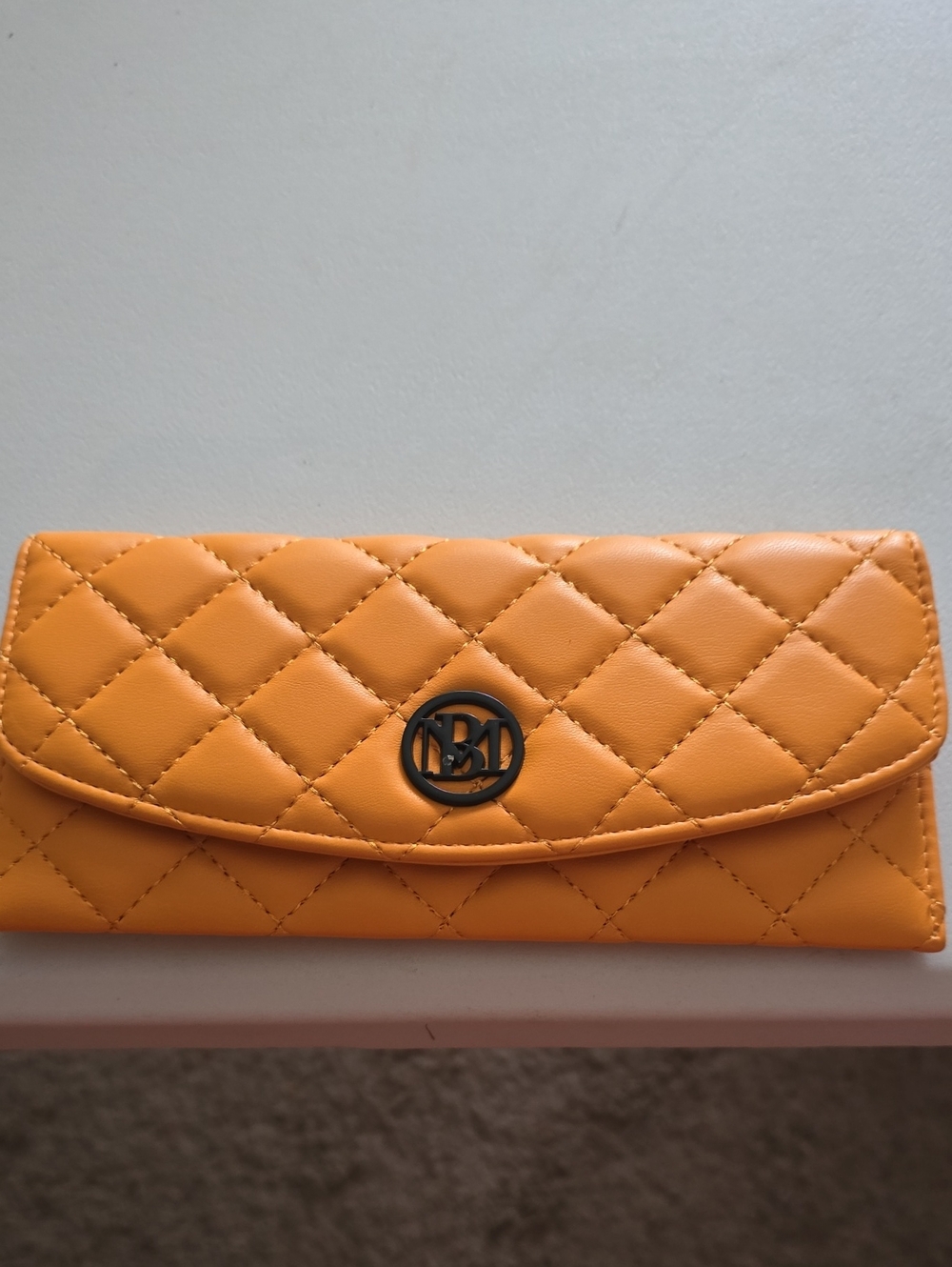 Quilted Yellow Wallet Clutch with Round Metal Emblem